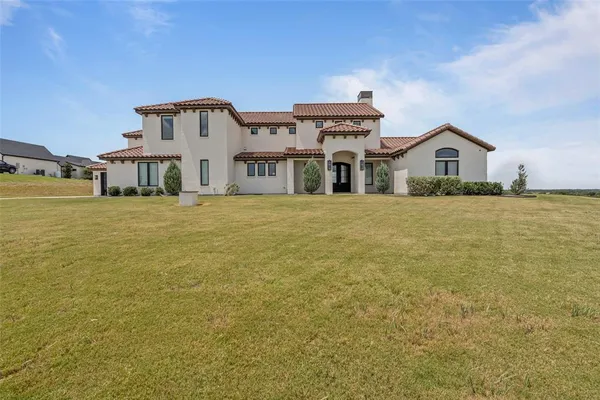 a big house with a big yard and more windows