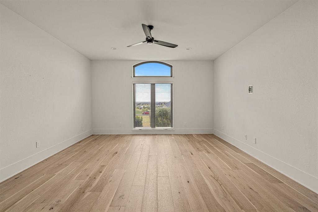 227 High View Trail Aledo, TX 76008 - Photo 14 of 40 wooden floor in an empty room with a window