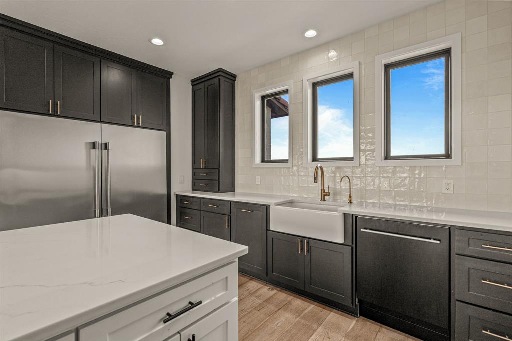 227 High View Trail Aledo, TX 76008 - Photo 15 of 40 a kitchen with a sink and cabinets