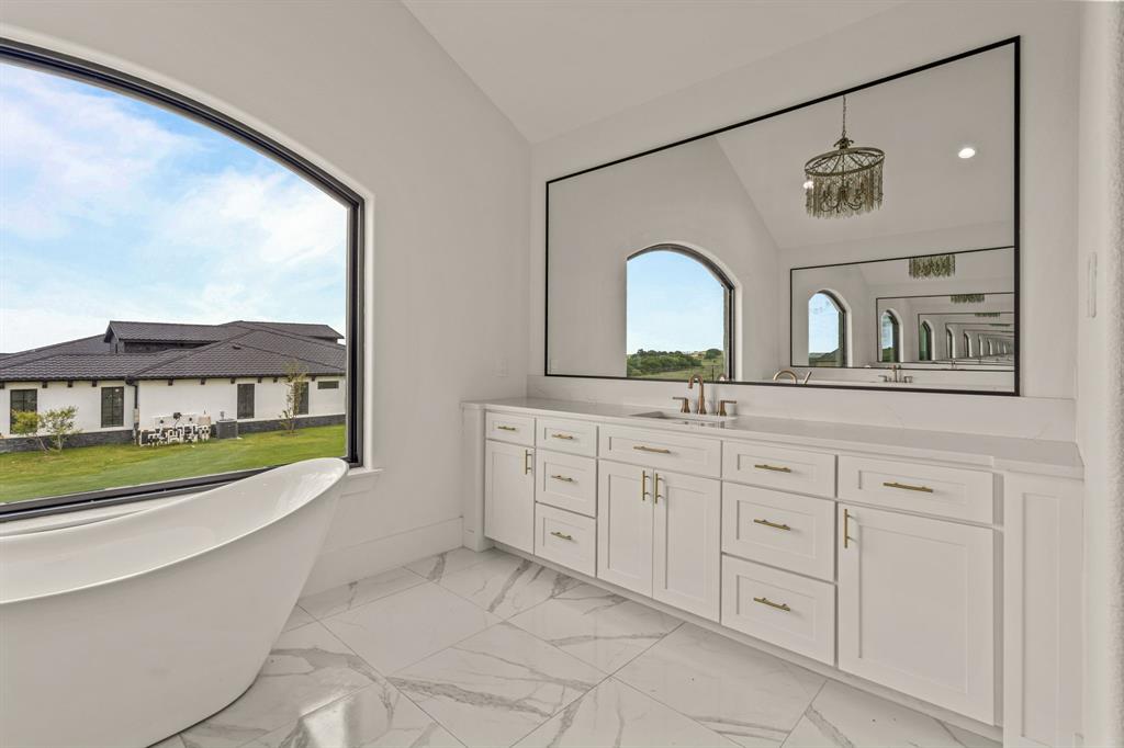 227 High View Trail Aledo, TX 76008 - Photo 21 of 40 a bathroom with a sink a vanity and a large mirror