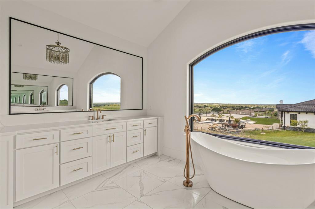 227 High View Trail Aledo, TX 76008 - Photo 22 of 40 a bathroom with a sink and a large mirror