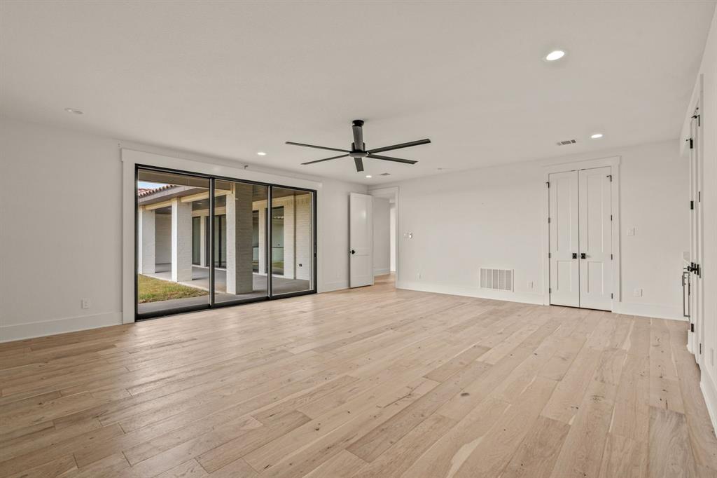 227 High View Trail Aledo, TX 76008 - Photo 27 of 40 a view of an empty room with wooden floor and a window