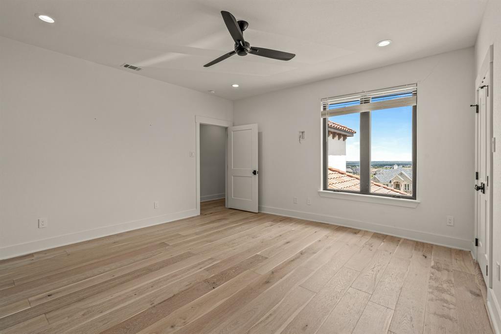 227 High View Trail Aledo, TX 76008 - Photo 35 of 40 a view of an empty room with a window and wooden floor