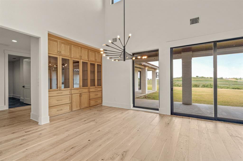 227 High View Trail Aledo, TX 76008 - Photo 10 of 40 a view of an empty room with window and wooden floor