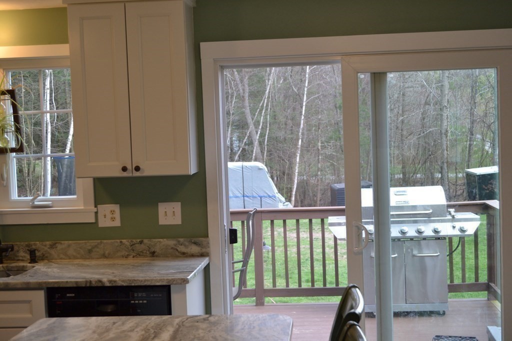 137 Center Depot Road Charlton, MA 01507 - Photo 11 of 31 a bathroom with a sink a mirror and next to a window