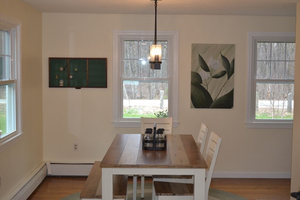 137 Center Depot Road Charlton, MA 01507 - Photo 13 of 31 a view of a dining room with furniture and wooden floor
