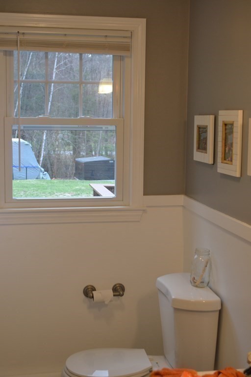 137 Center Depot Road Charlton, MA 01507 - Photo 18 of 31 a bathroom with a toilet a sink and a window