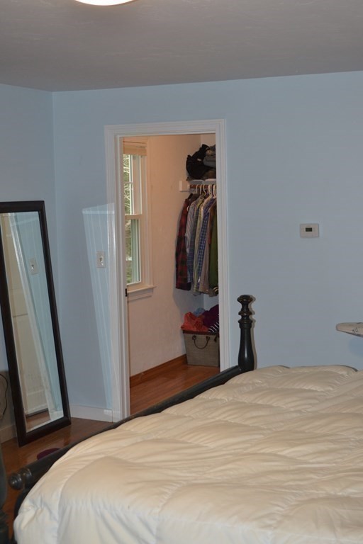 137 Center Depot Road Charlton, MA 01507 - Photo 26 of 31 a bedroom with a bed and a mirror