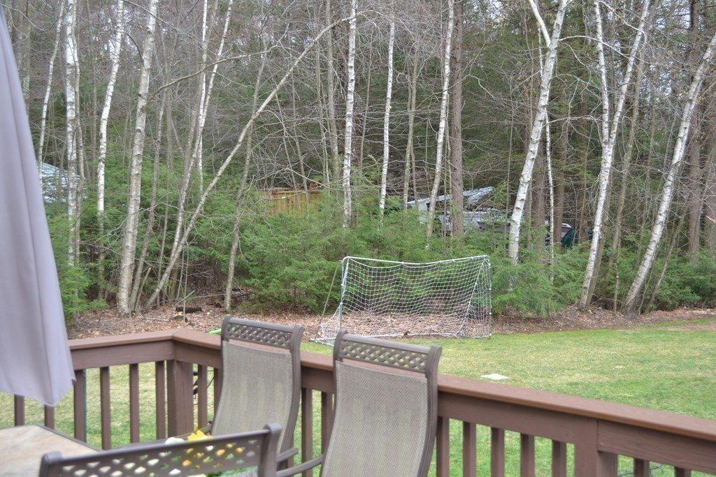 137 Center Depot Road Charlton, MA 01507 - Photo 28 of 31 a view of a chair and tables in the backyard