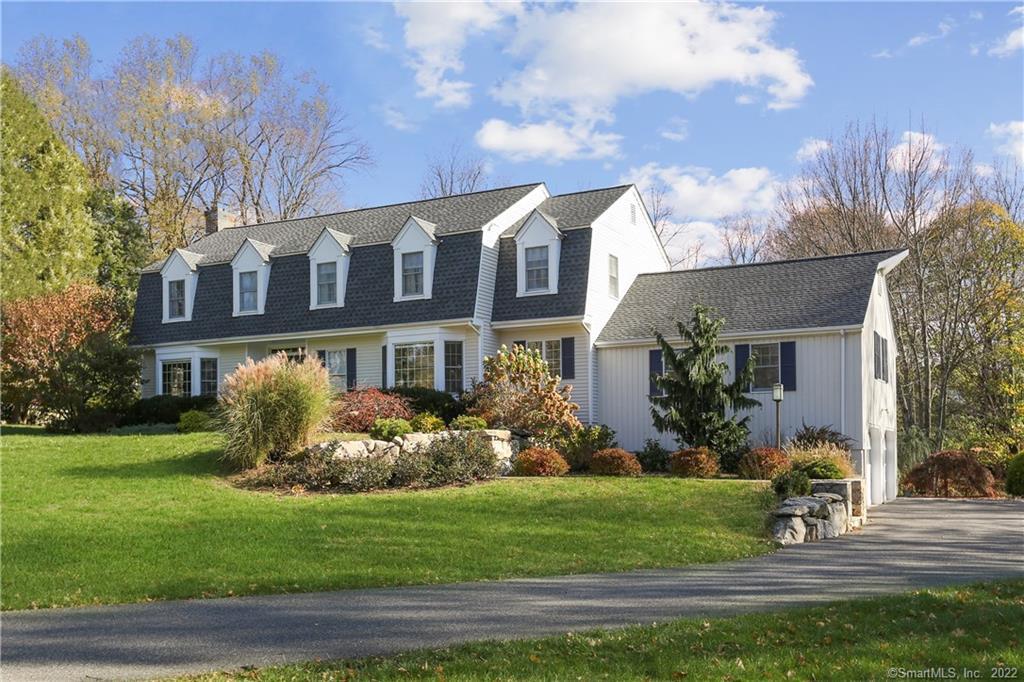 15 Turner Ridge Court Wilton, CT 06897 - Photo 1 of 1 a front view of a house with garden