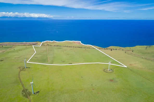 a blue swimming pool is in a blue room