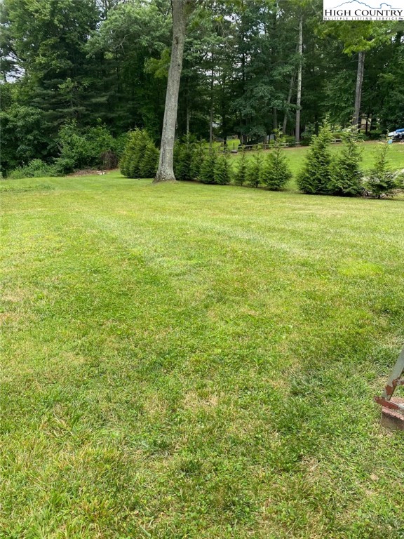 4122 Ridgeglen Road Sparta, NC 28675 - Photo 4 of 30 a view of a field with a trees in the background