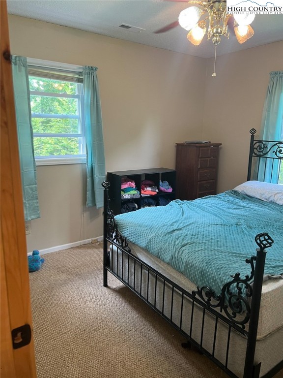 4122 Ridgeglen Road Sparta, NC 28675 - Photo 8 of 30 a bedroom with a bed and window