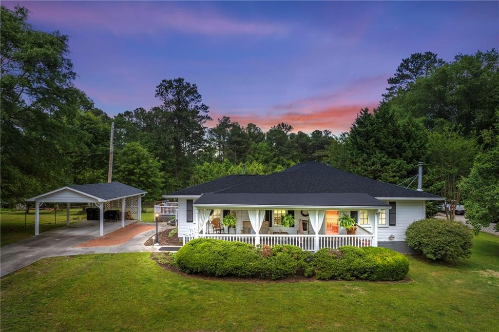 158 Stockmar Road Villa Rica, GA 30180 - Photo 1 of 1 a front view of a house with garden