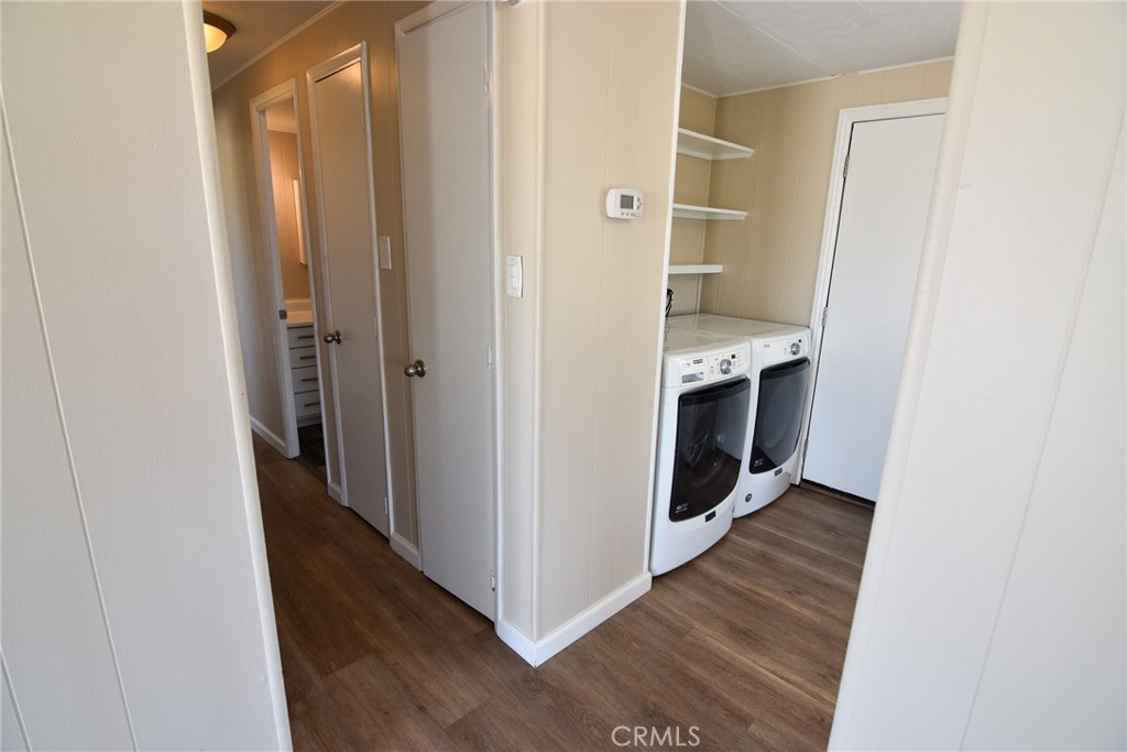 340 3rd Avenue, Unit 43 Pacifica, CA 94044 - Photo 6 of 19 a view of a hallway with wooden floor and a sink