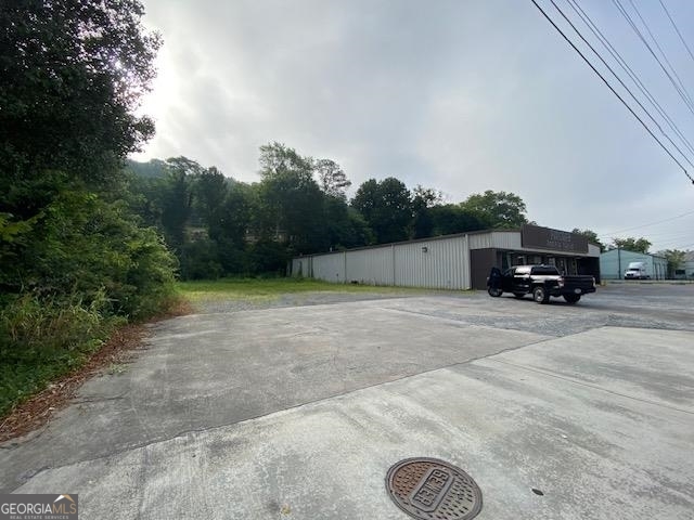 0 Wall Street Calhoun, GA 30701 - Photo 4 of 7 a car parked in front of a house