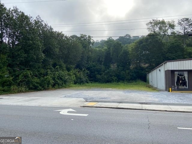 0 Wall Street Calhoun, GA 30701 - Photo 5 of 7 a backyard of a house with lots of green space and trees