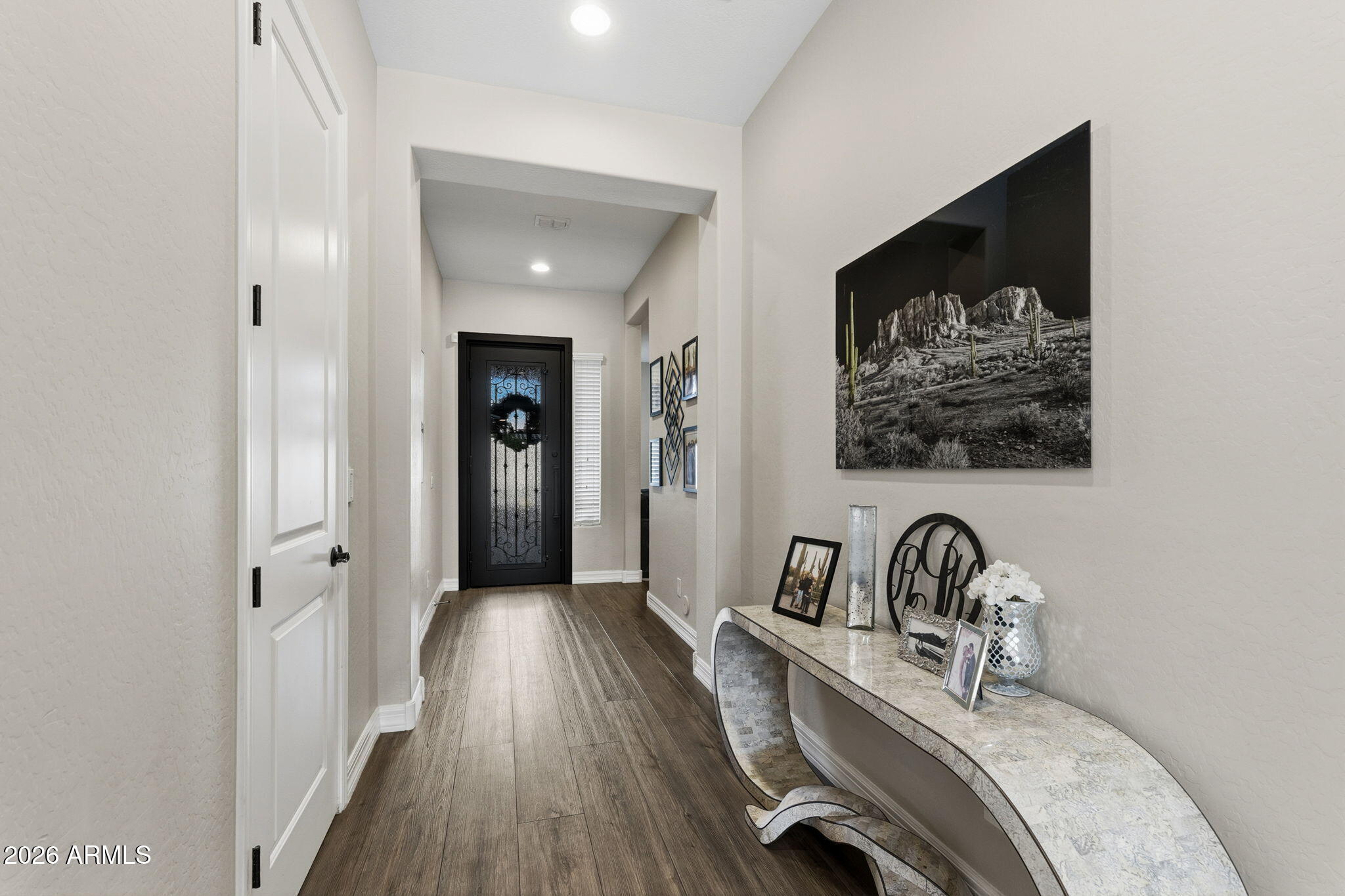 3921 East Chestnut Lane Gilbert, AZ 85298 - Photo 2 of 18 an entryway to room with wooden floor