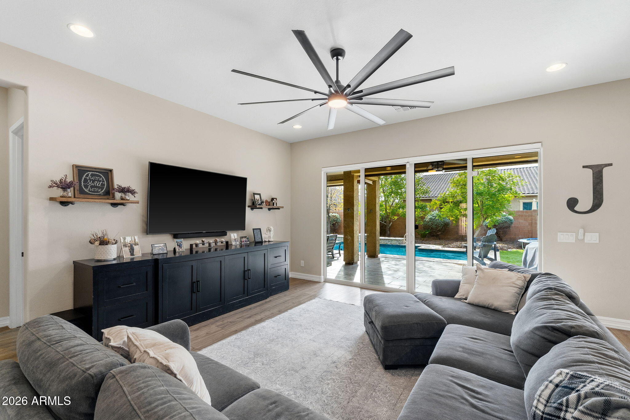 3921 East Chestnut Lane Gilbert, AZ 85298 - Photo 6 of 18 a living room with furniture and a flat screen tv