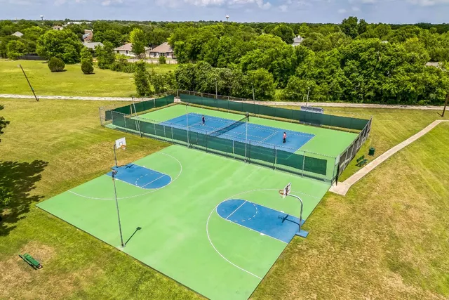a view of a pool with a yard