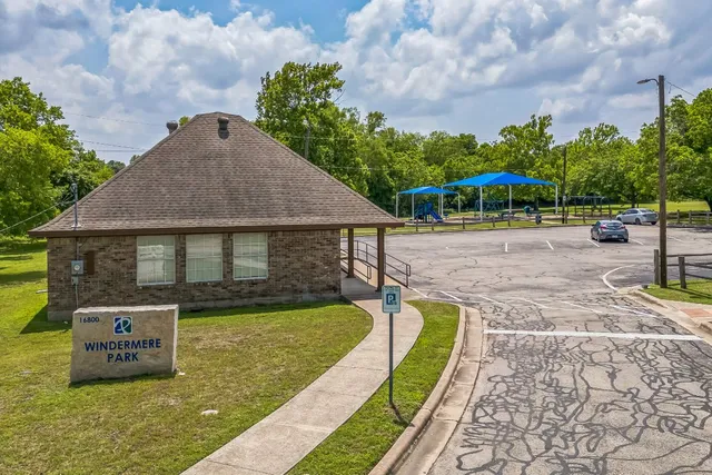 a swimming pool with some trees in the background