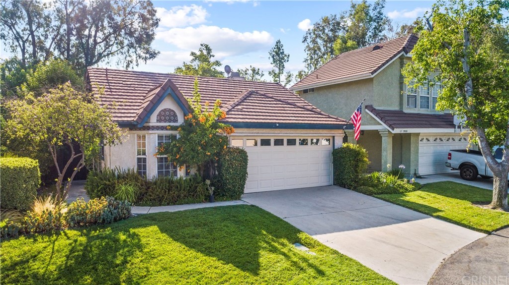 19816 Collins Road Canyon Country, CA 91351 - Photo 1 of 1 a front view of a house with garden