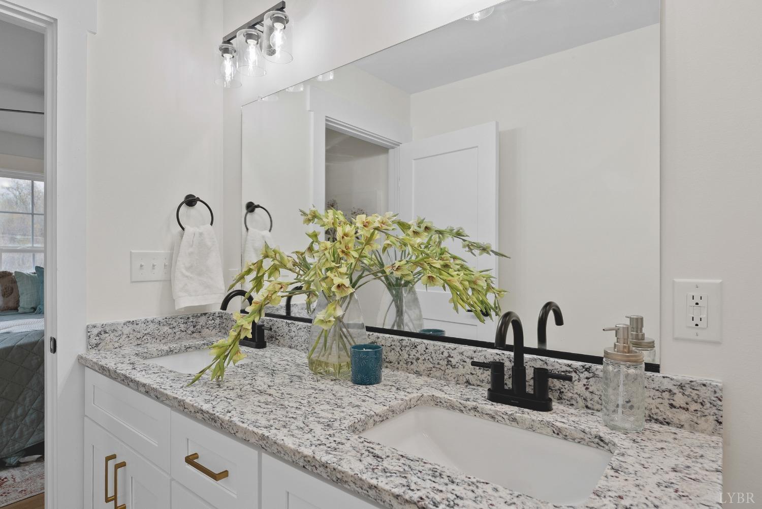 93 Halsey Road Lynchburg, VA 24501 - Photo 14 of 24 a bathroom with a granite countertop sink and a mirror