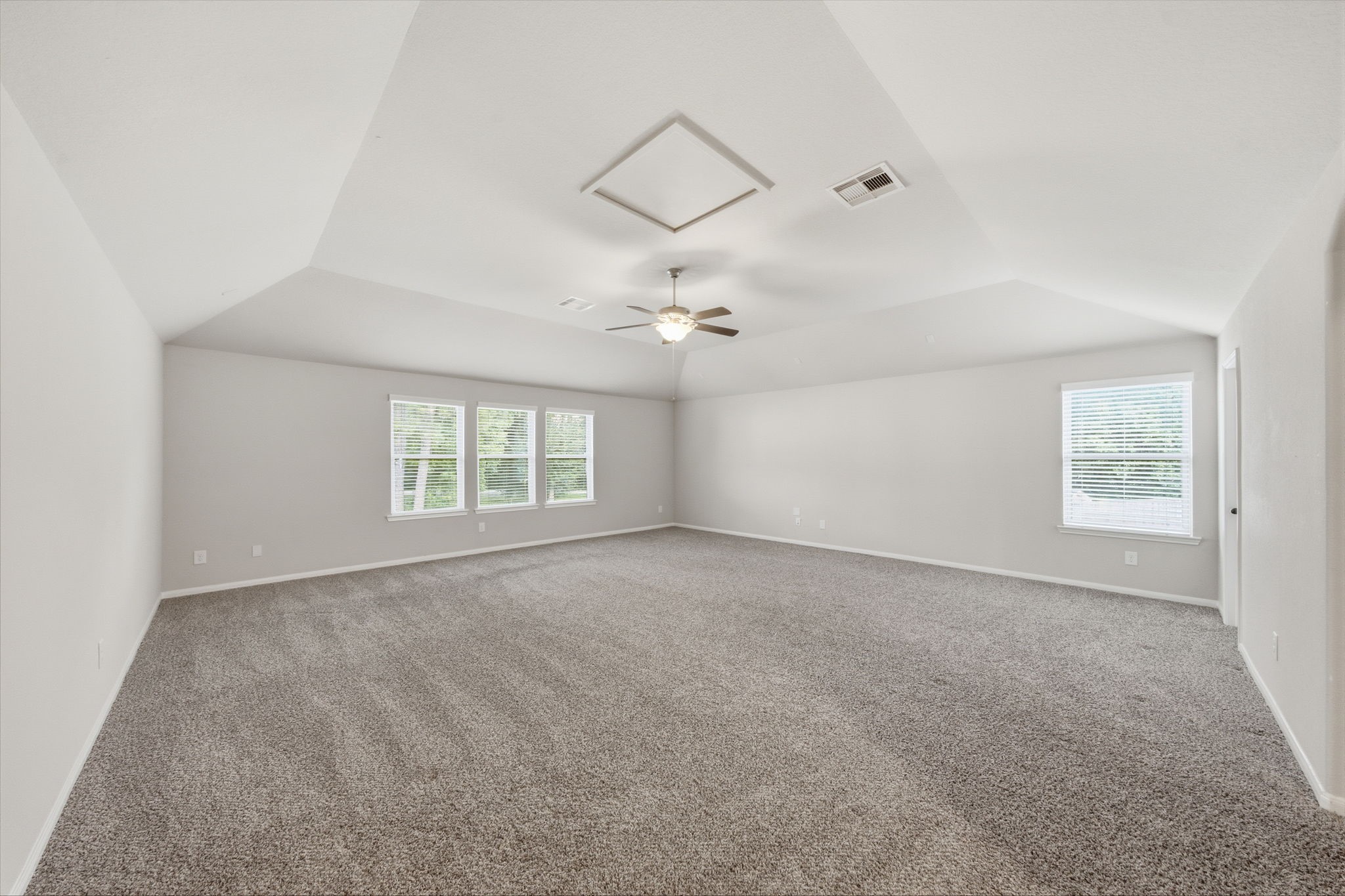7611 Willow School Drive Spring, TX 77389 - Photo 12 of 23 an empty room with windows and ceiling fan