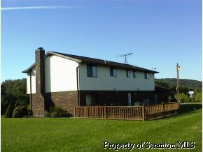 939 Line Rd Lake Lake Ariel, PA 18436 - Photo 2 of 3 a front view of a house with a yard