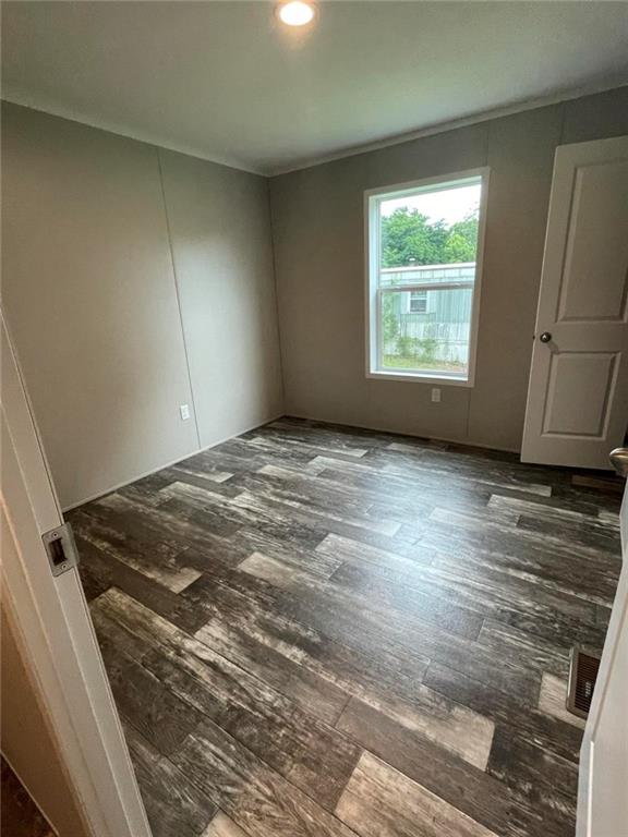 5118 A Holly Road Mount Pleasant, PA 15666 - Photo 11 of 17 an empty room with wooden floor and windows