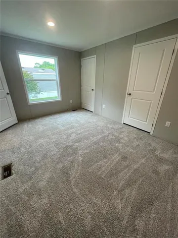 a view of an empty room and a window