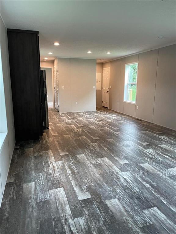 5118 A Holly Road Mount Pleasant, PA 15666 - Photo 4 of 17 an empty room with wooden floor and a window