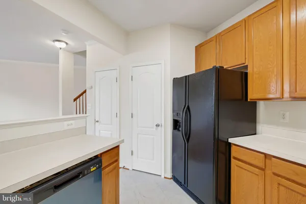 a kitchen with stainless steel appliances a refrigerator and a sink