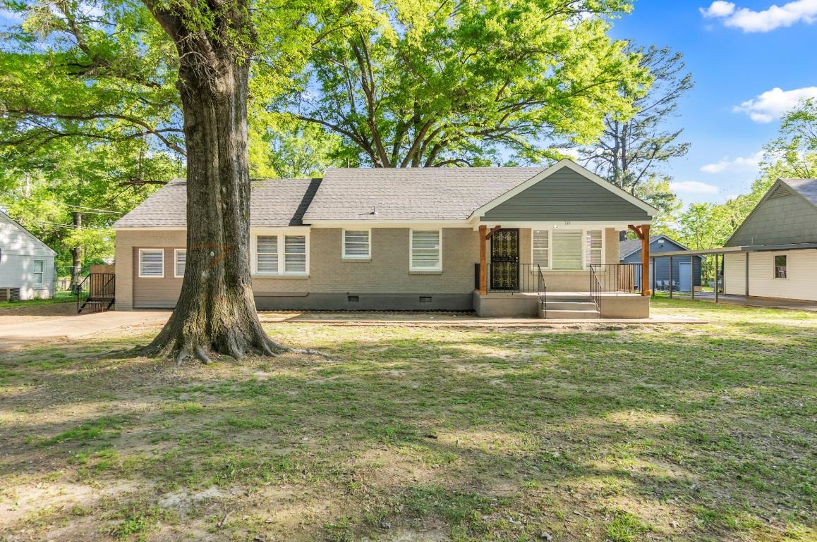749 Lydgate Road Memphis, TN 38116 - Photo 1 of 30 a front view of a house with a garden