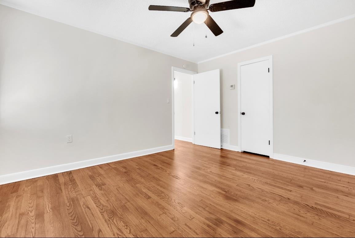 749 Lydgate Road Memphis, TN 38116 - Photo 10 of 30 a view of an empty room with wooden floor
