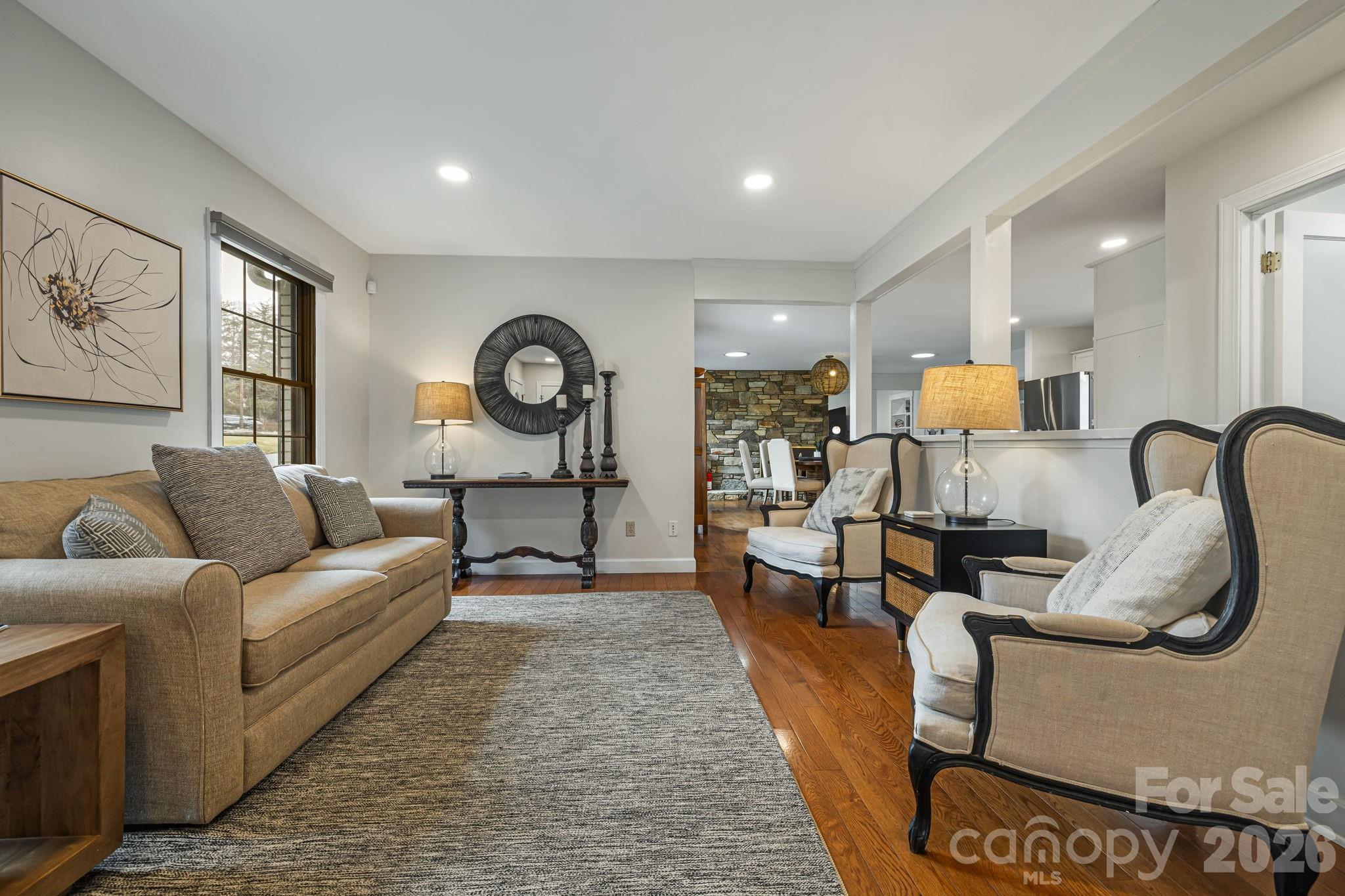 1236 Upper Brush Creek Road Fairview, NC 28730 - Photo 11 of 48 a living room with furniture and wooden floor