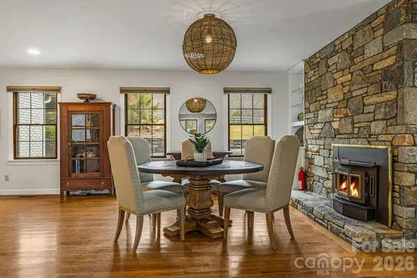 a view of a dining room with furniture window and wooden floor