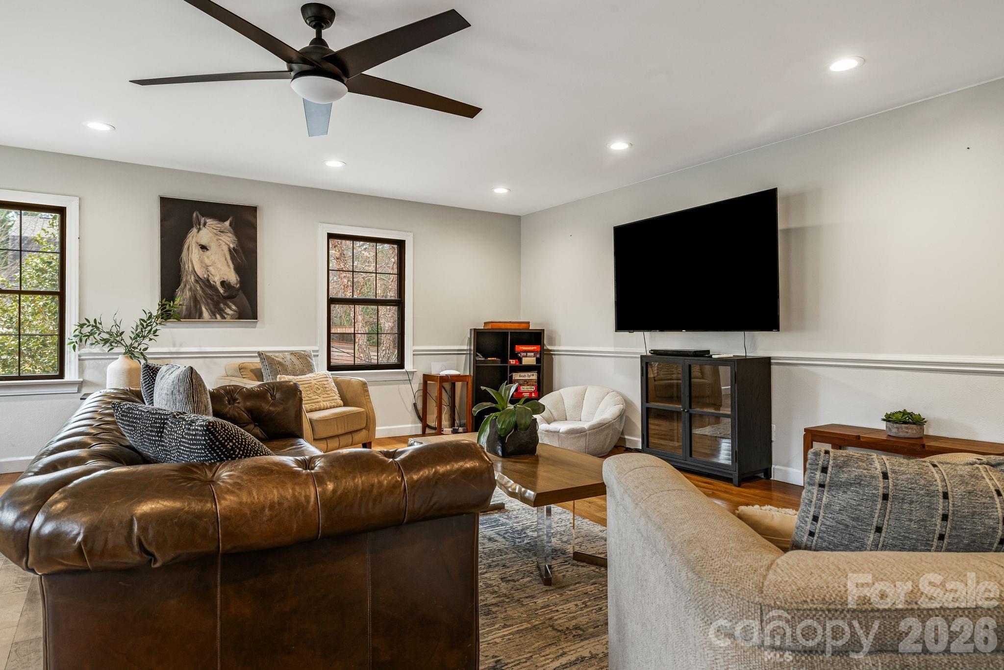 1236 Upper Brush Creek Road Fairview, NC 28730 - Photo 22 of 48 a living room with furniture and a flat screen tv