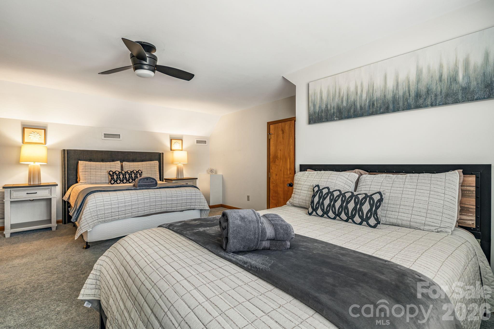 1236 Upper Brush Creek Road Fairview, NC 28730 - Photo 32 of 48 a bedroom with bed and a night stand