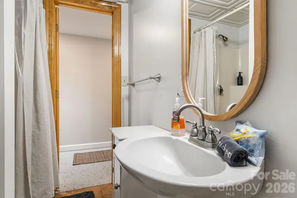 a bathroom with a sink and a mirror