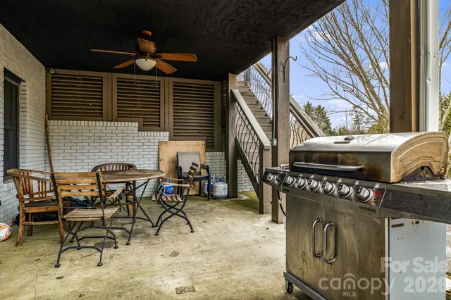 a patio with table and chairs