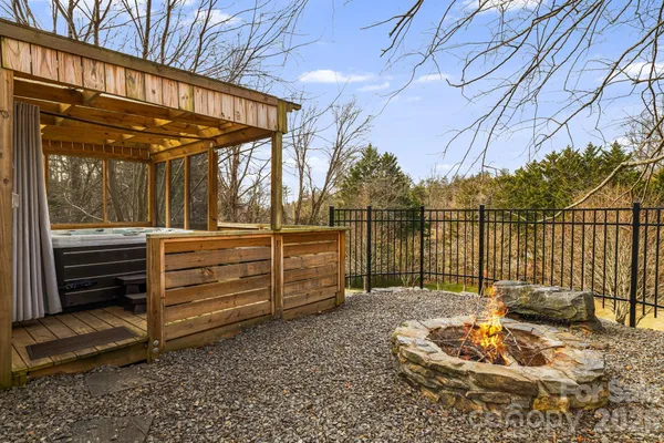 a view of a backyard with sitting area