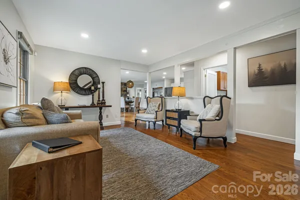a living room with furniture and a rug