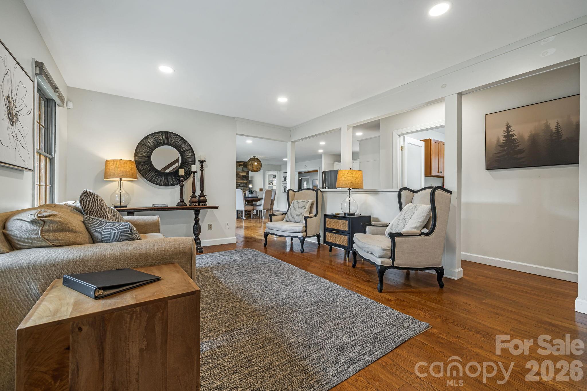 1236 Upper Brush Creek Road Fairview, NC 28730 - Photo 10 of 48 a living room with furniture and a rug