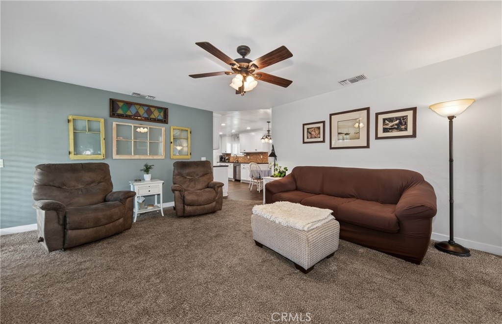 13689 Bryant Street Yucaipa, CA 92399 - Photo 12 of 30 a living room with furniture and a ceiling fan