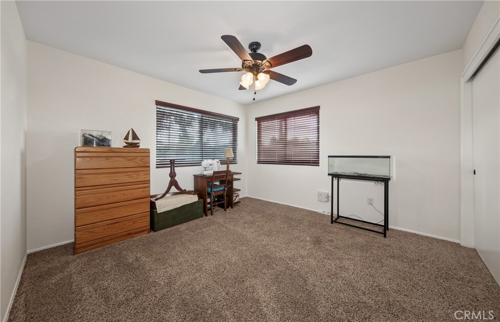 13689 Bryant Street Yucaipa, CA 92399 - Photo 22 of 30 a view of a livingroom with furniture and a ceiling fan