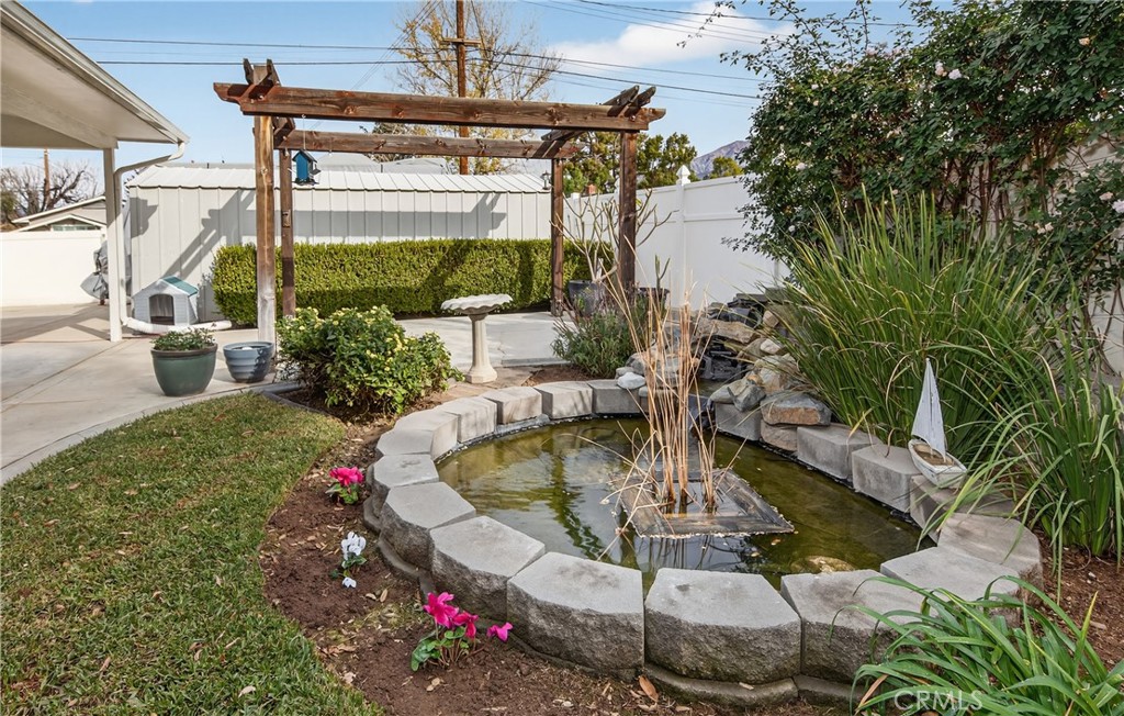 13689 Bryant Street Yucaipa, CA 92399 - Photo 26 of 30 a swimming pool with outdoor seating and plants