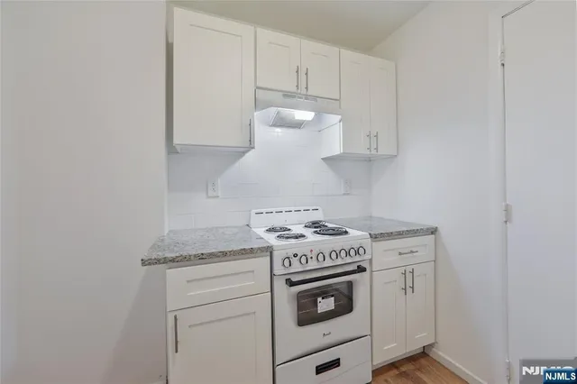 a kitchen with a stove and a sink