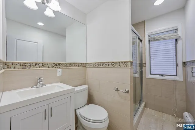 a bathroom with a sink a mirror and a toilet