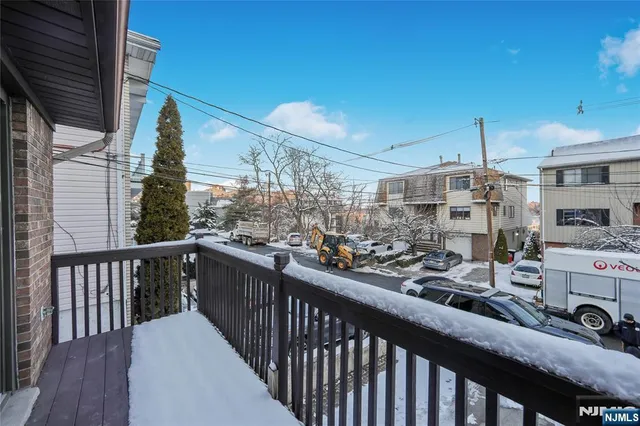 a view of a porch with wooden floor